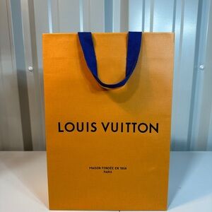 Louis Vuitton Vibrant Orange Bag with Bold Blue Handles